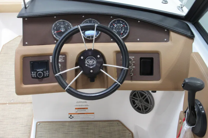 Slide: The Image of Steering console of a 2017 Cobalt CS1 boat with gauges and controls. - 6