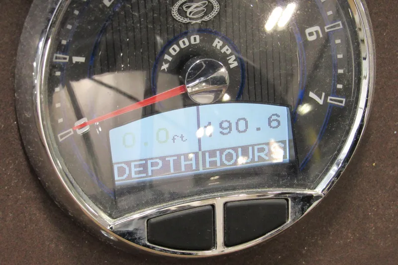 Slide: The Image of Close-up of a 2017 Cobalt CS1 gauge displaying RPM and depth hours. - 7