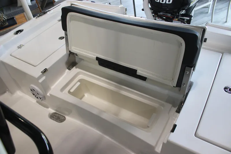 Slide: The Image of 2026 Tidewater 2300 Carolina Bay boat with open storage compartment and seating. - 19