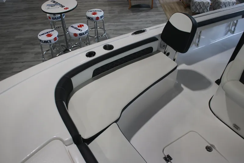 Slide: The Image of 2026 Tidewater 2300 Carolina Bay boat interior with seating and Suzuki-branded stools. - 20