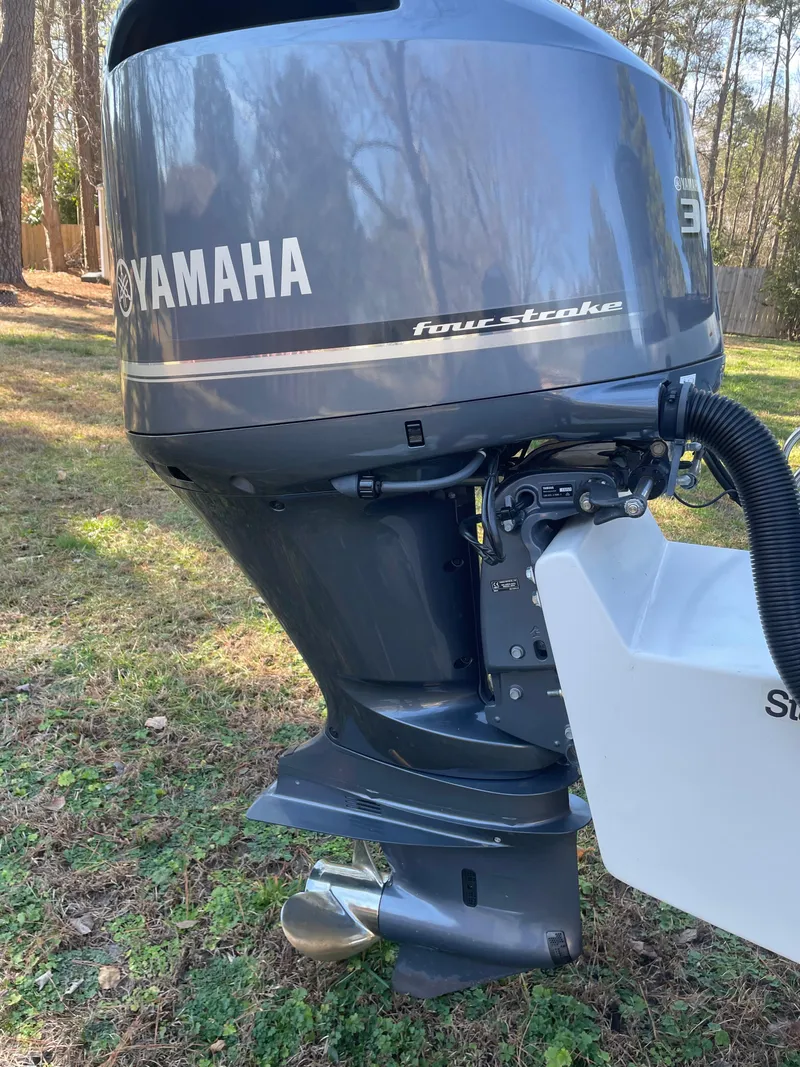 Slide: The Image of Close-up of a Yamaha four-stroke outboard motor on a 2004 Hydra-Sports 230 WA boat. - 2