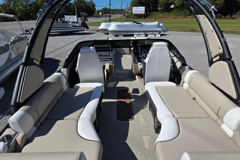 Slide: The Image of 2026 Avalon 2785 Excalibur LTD boat interior with quad lounger seating and windshield. - 16