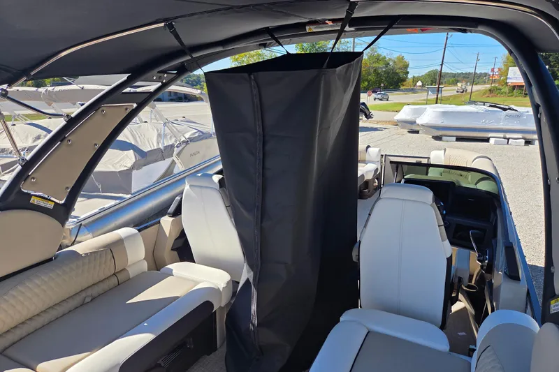 Slide: The Image of 2026 Avalon 2785 Excalibur LTD boat interior with quad lounger and windshield. - 18
