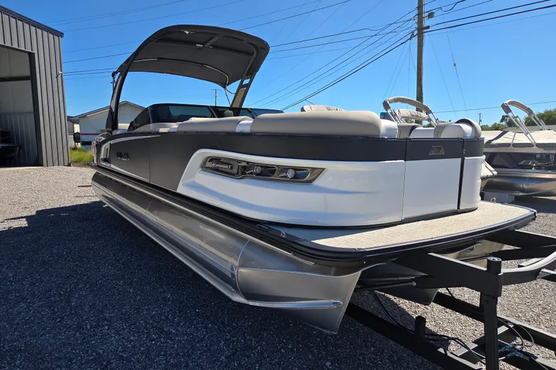 Slide: The Image of 2026 Avalon 2785 Excalibur LTD pontoon boat with quad lounger and windshield. - 3