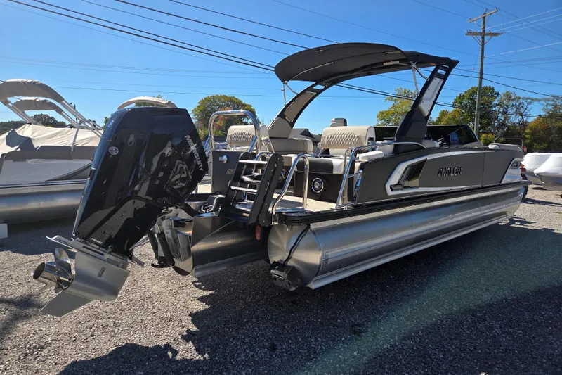Slide: The Image of 2026 Avalon 2785 Excalibur LTD Windshield Quad Lounger boat with Mercury outboard engine. - 5