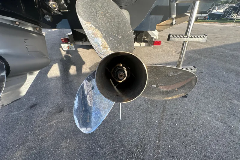 Slide: The Image of 2001 Contender 35 Side Console boat interior with sink, storage, and rod holders. - 14