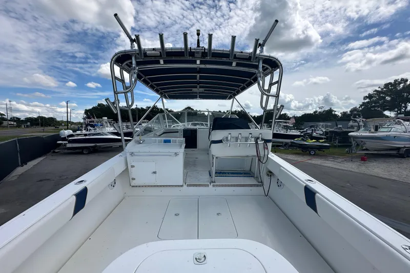 Slide: The Image of 2001 Contender 35 Side Console boat interior with sink and storage area. - 16
