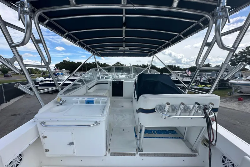 Slide: The Image of Open compartment on 2001 Contender 35 Side Console boat showing plumbing and hoses. - 19