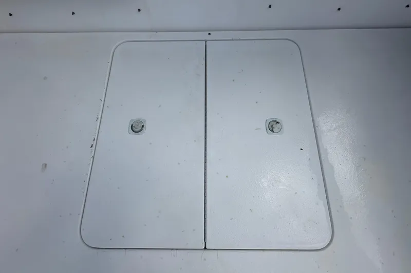 Slide: The Image of 2001 Contender 35 Side Console boat helm with steering wheel and controls. - 21