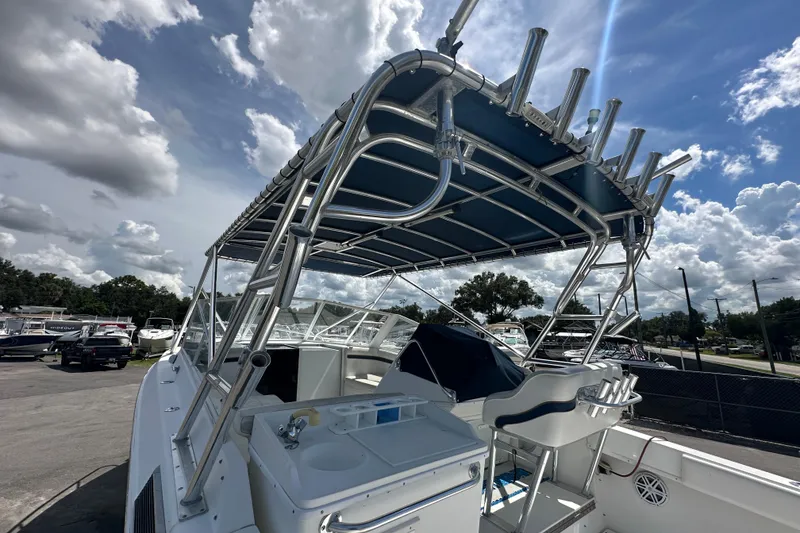 Slide: The Image of Close-up of a 2001 Contender 35 Side Console RPM gauge displaying 637 hours. - 26