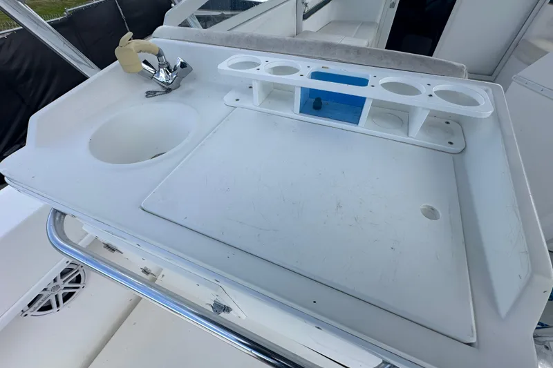 Slide: The Image of Steering console of a 2001 Contender 35 Side Console boat with navigation instruments. - 29