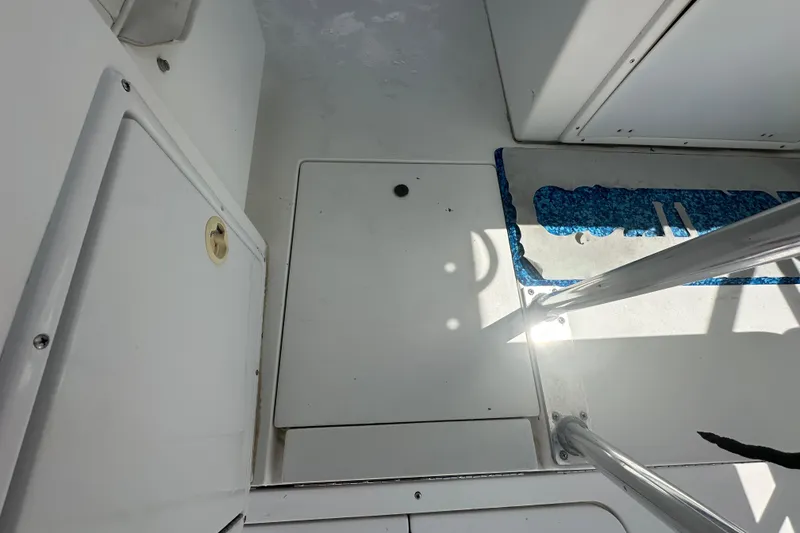 Slide: The Image of Control panel of a 2001 Contender 35 Side Console boat with Mercury start/stop buttons. - 30