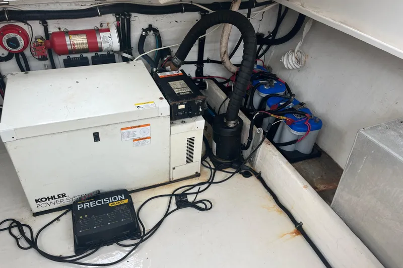 Slide: The Image of Simrad marine radio and speaker on 2001 Contender 35 Side Console boat dashboard. - 32