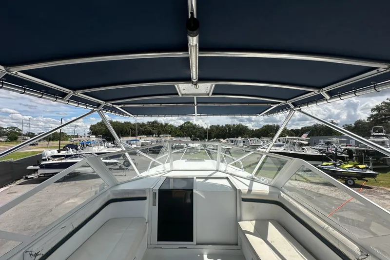 Slide: The Image of White seating on a 2001 Contender 35 Side Console boat, showing wear and shadow. - 38