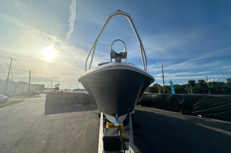 Slide: The Image of 2001 Contender 35 Side Console boat with dual propellers, displayed at a boat sale. - 4