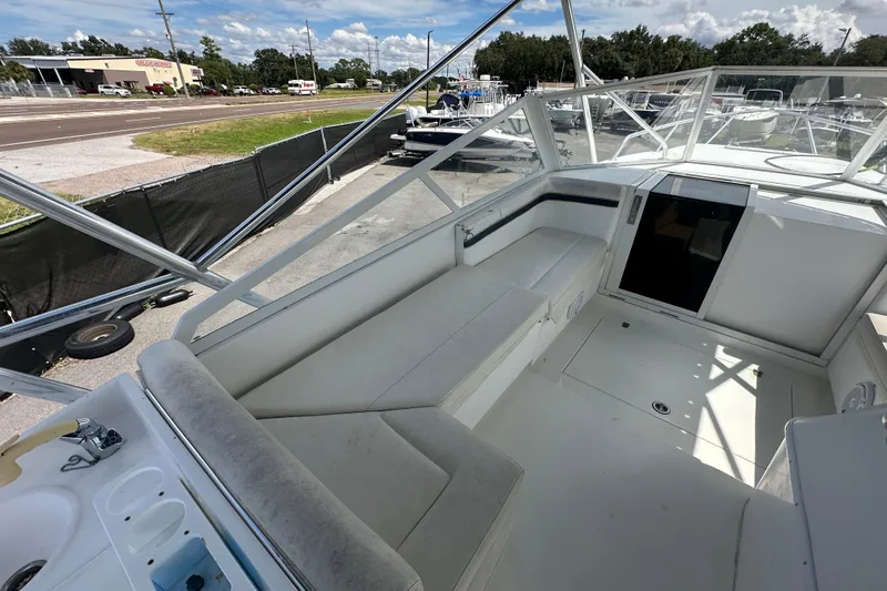 Slide: The Image of Worn seating on a 2001 Contender 35 Side Console boat, showing signs of aging. - 40