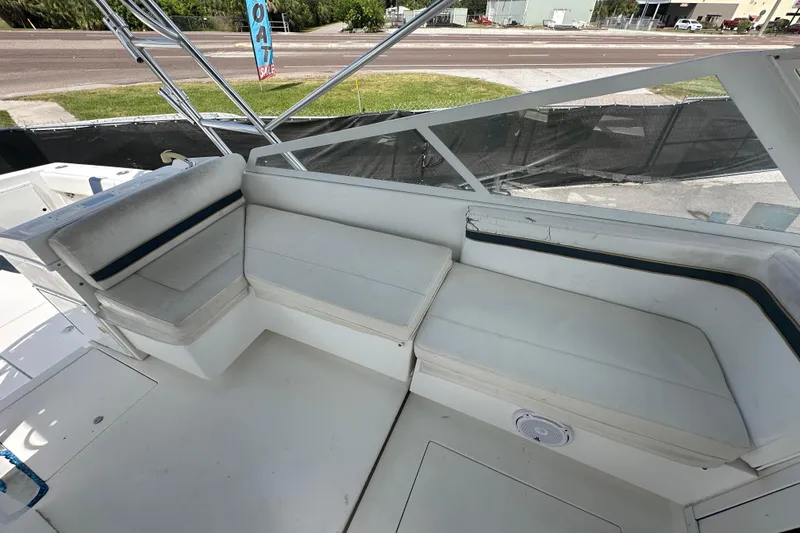 Slide: The Image of 2001 Contender 35 Side Console boat interior with storage hatch and speakers. - 42
