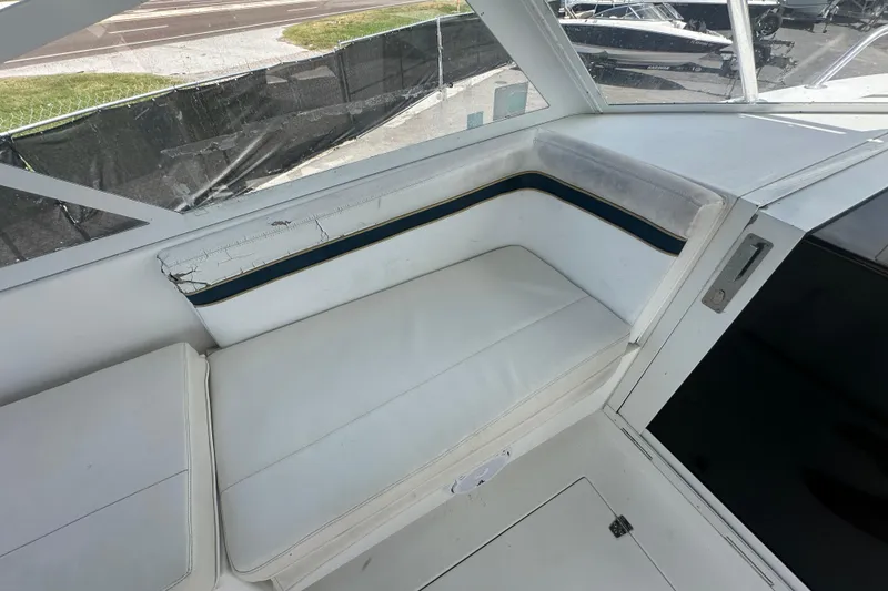 Slide: The Image of 2001 Contender 35 Side Console boat interior with seating and windshield view. - 45