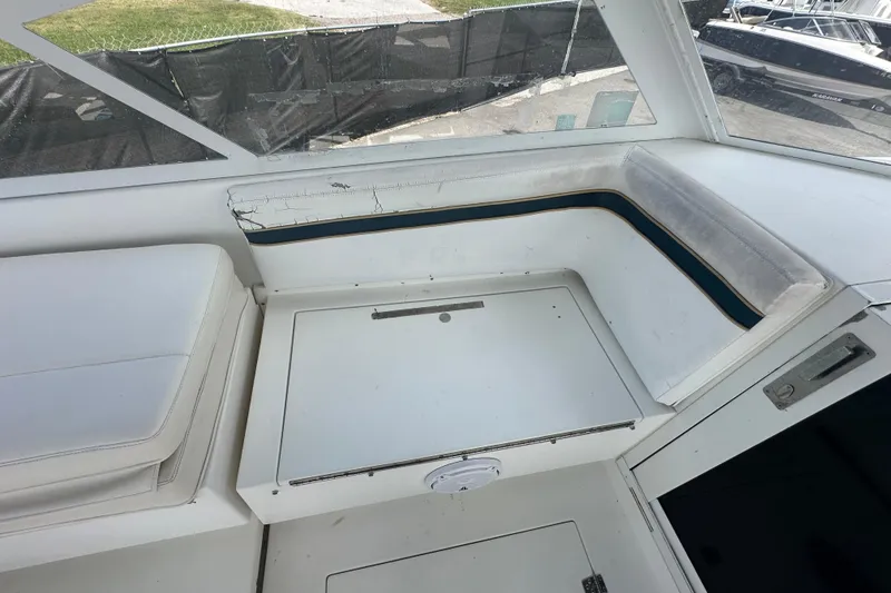 Slide: The Image of 2001 Contender 35 Side Console boat deck with railing and hatch. - 46