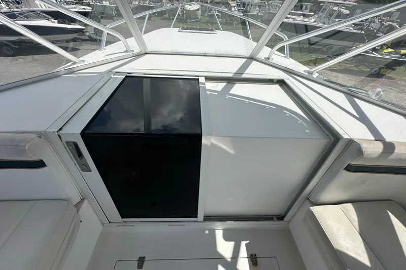 Slide: The Image of Bow view of 2001 Contender 35 Side Console boat with anchor and railings. - 48