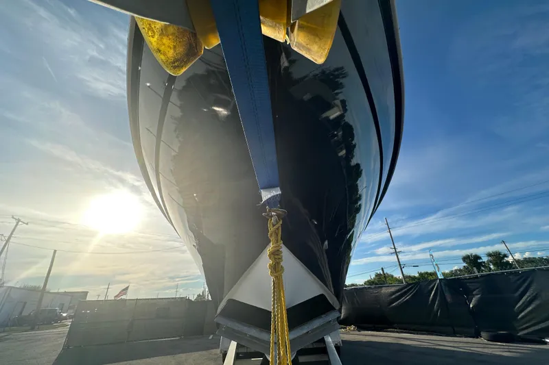 Slide: The Image of 2001 Contender 35 Side Console boat with Mercury Verado engine on trailer. - 5