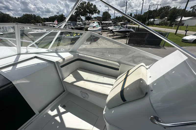 Slide: The Image of 2001 Contender 35 Side Console cabin entrance with sink and seating area. - 53
