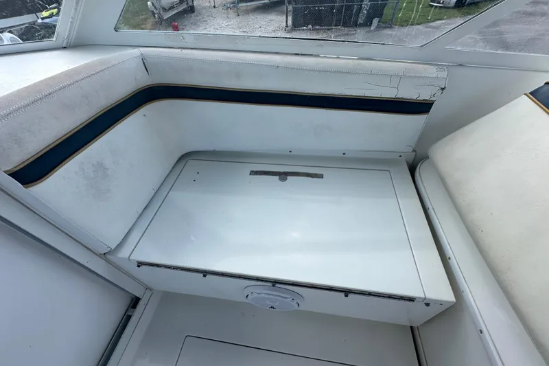Slide: The Image of 2001 Contender 35 Side Console interior with sink, seating, and wooden accents. - 54