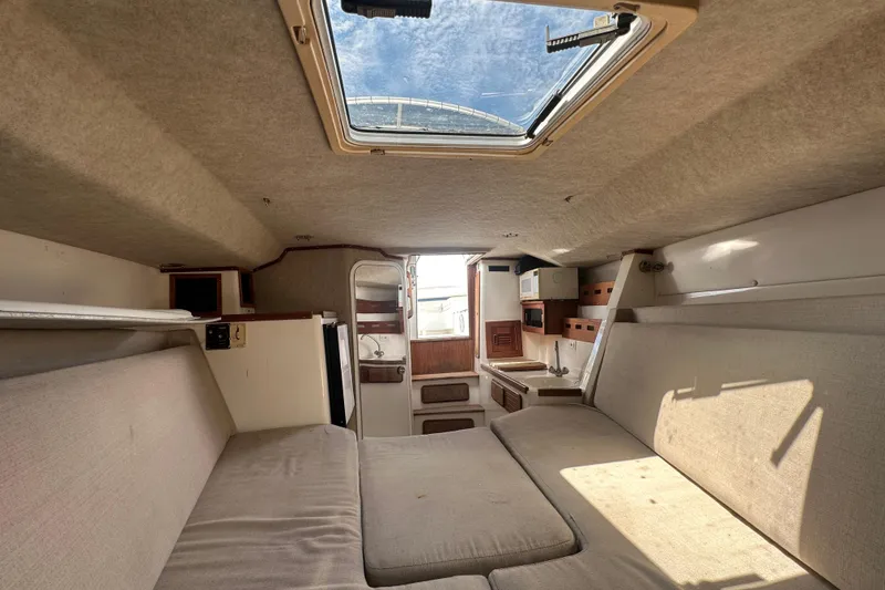 Slide: The Image of Wooden hatch cover on a 2001 Contender 35 Side Console boat interior. - 58