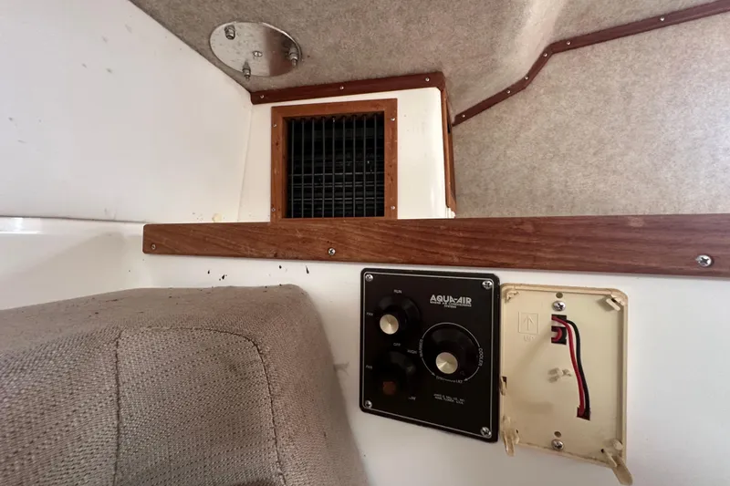 Slide: The Image of Alcohol stove on 2001 Contender 35 Side Console boat, featuring electronic controls and stainless steel surface. - 59