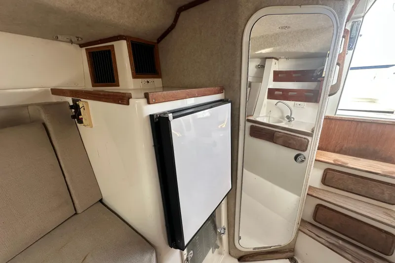 Slide: The Image of Small sink with metal faucet in 2001 Contender 35 Side Console boat. - 60