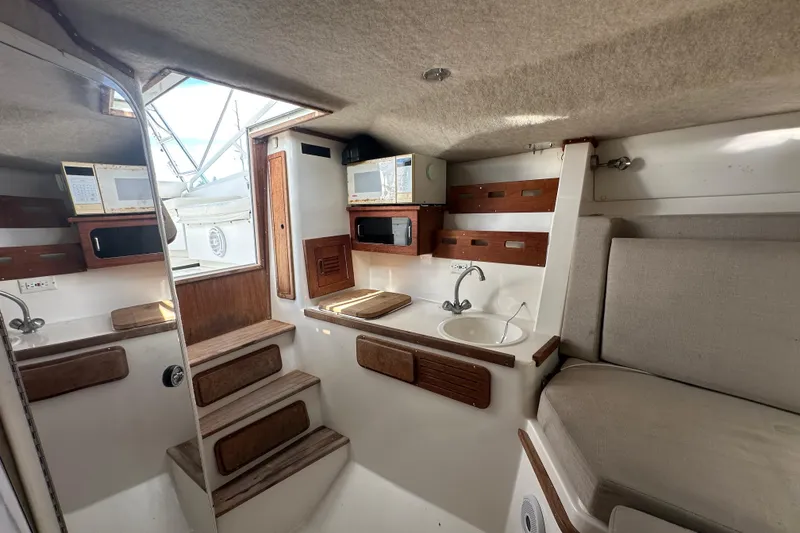 Slide: The Image of Open storage compartment on 2001 Contender 35 Side Console boat deck. - 66