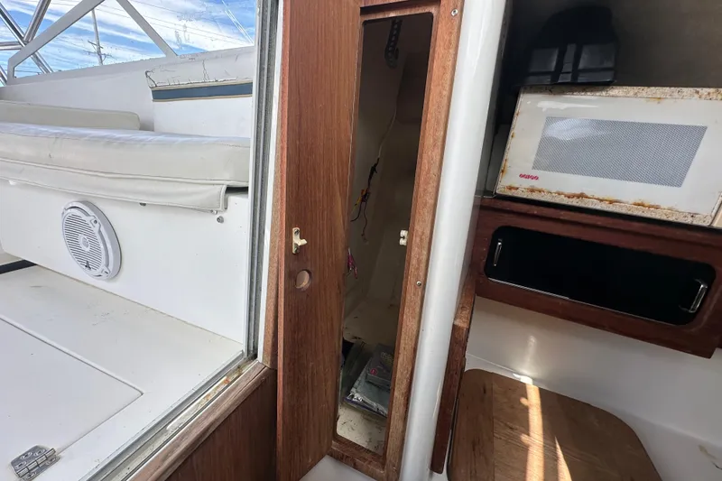 Slide: The Image of Storage compartment of a 2001 Contender 35 Side Console boat, open and empty. - 67