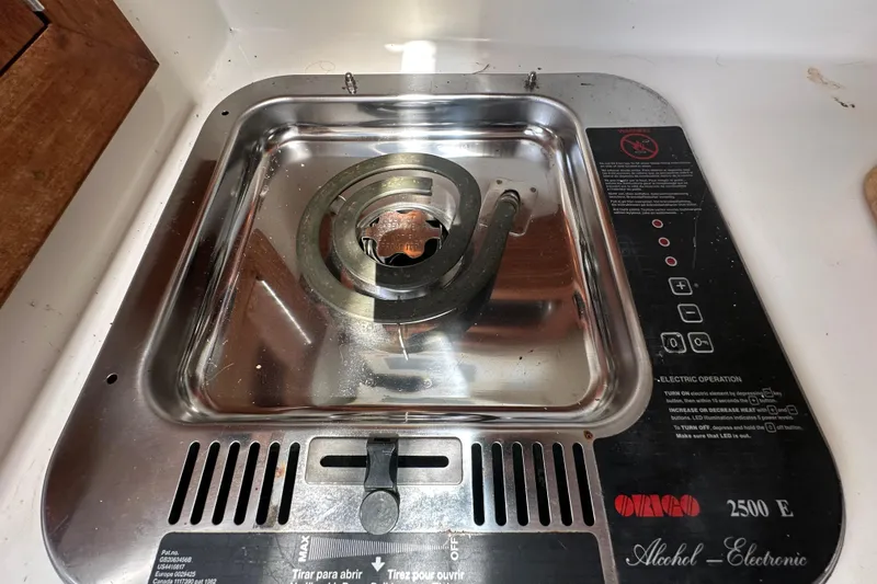 Slide: The Image of 2001 Contender 35 Side Console interior with table and speakers. - 70