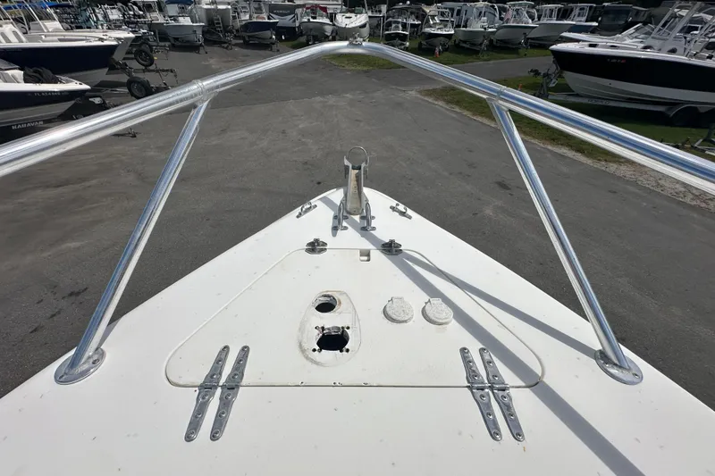 Slide: The Image of 2001 Contender 35 Side Console boat interior with compact bathroom and sink. - 80