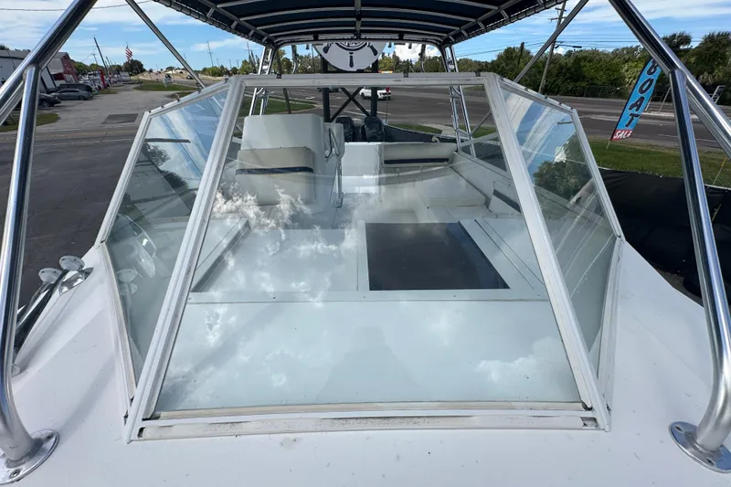 Slide: The Image of 2001 Contender 35 Side Console boat interior with seating and console view. - 87