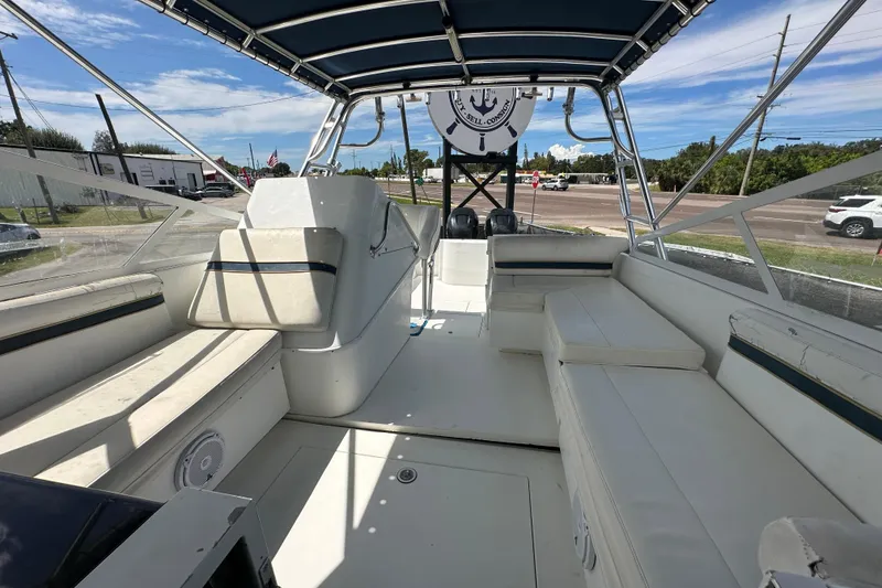 Slide: The Image of 2001 Contender 35 Side Console engine compartment with fire extinguisher and wiring. - 89