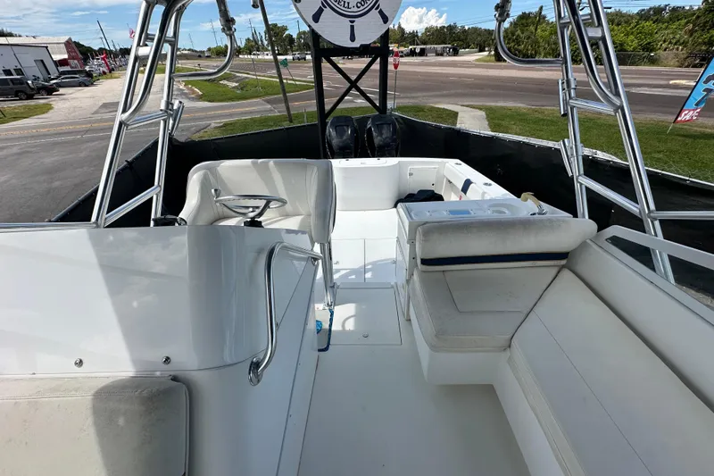 Slide: The Image of 2001 Contender 35 Side Console boat with twin outboard engines, rear deck view. - 92