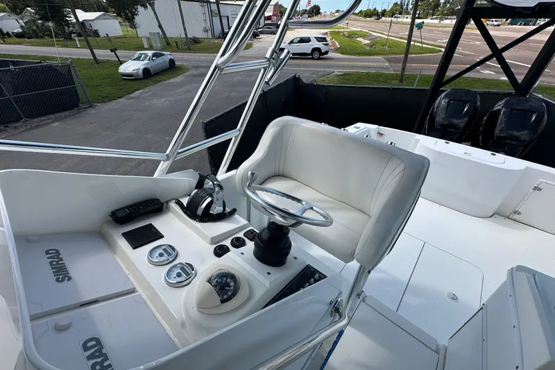 Slide: The Image of 2001 Contender 35 Side Console boat with dual Mercury outboard engines. - 93