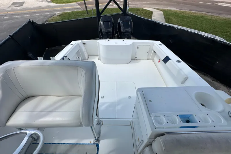 Slide: The Image of 2001 Contender 35 Side Console boat interior compartment with white panel and hinges. - 96