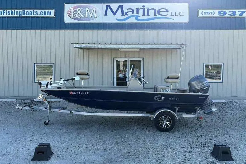 Slide: The Image of 2021 G3 Bay 17 boat on trailer outside L&M Marine LLC building. - 0