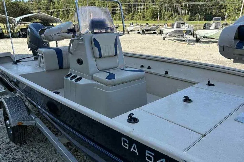 Slide: The Image of 2021 G3 Bay 17 boat with seating and console, parked on a trailer. - 5