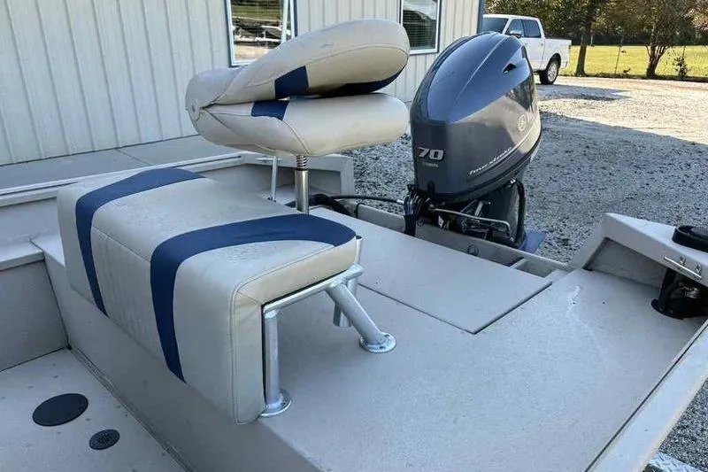 Slide: The Image of 2021 G3 Bay 17 boat with cushioned seating and 70 HP outboard motor. - 8