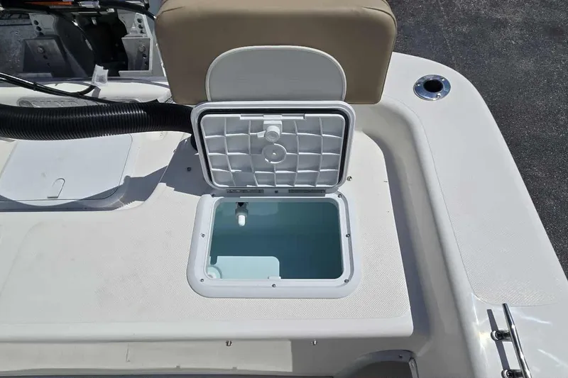 Slide: The Image of Open storage compartment on 2026 Sundance B22CCR boat deck. - 17