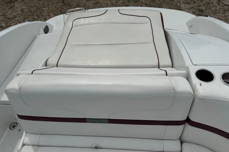 Slide: The Image of 2007 Formula 240 Bowrider boat interior with white leather seating and cup holders. - 11
