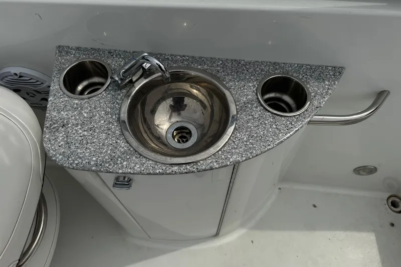 Slide: The Image of Granite countertop with sink and cup holders on 2007 Formula 240 Bowrider boat. - 15