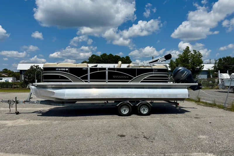 The Image of 2018 Sylvan Mirage Cruise 8522 LZ pontoon boat on trailer under blue sky. - 0