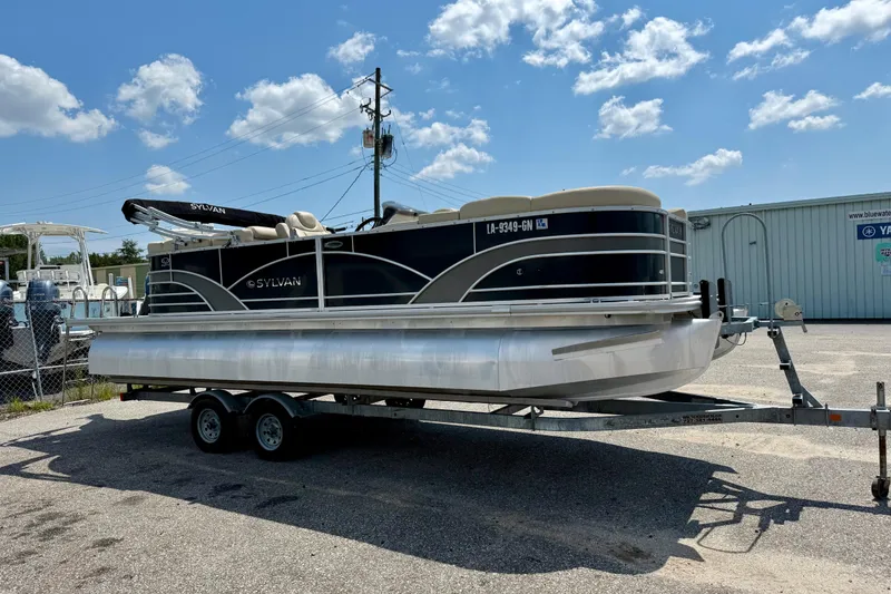 Slide: The Image of 2018 Sylvan Mirage Cruise 8522 LZ pontoon boat on trailer under blue sky. - 2