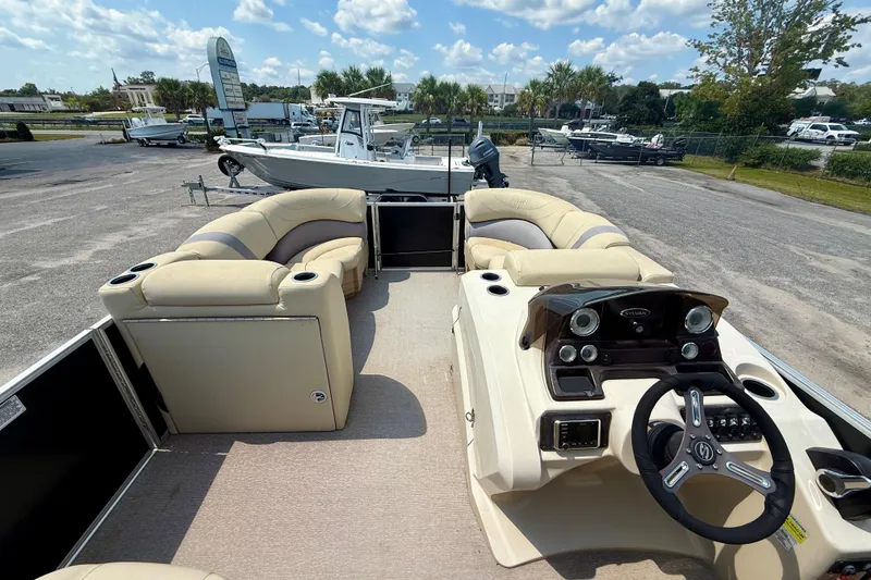 Slide: The Image of 2018 Sylvan Mirage Cruise 8522 LZ pontoon boat with beige seating and modern dashboard. - 5