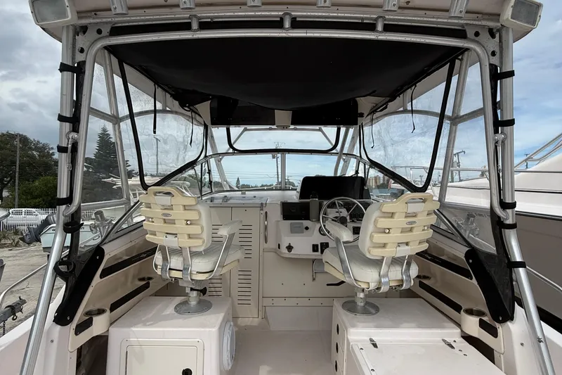 Slide: The Image of 2001 Grady-White Marlin 300 boat interior with helm and seating area. - 20