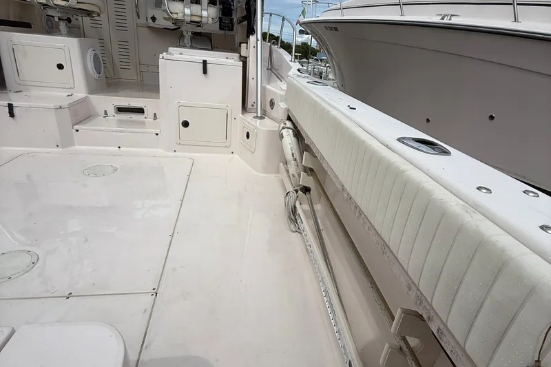 Slide: The Image of 2001 Grady-White Marlin 300 boat interior with seating and storage compartments. - 23